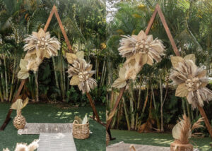 large triangle wooden arch for weddings and events with pampas grass